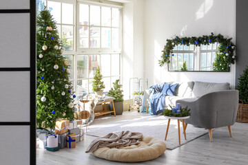 Interior of decorated living room with Christmas tree