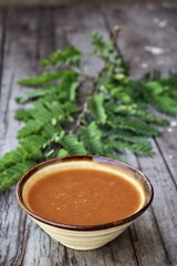 Tamarind sauce on old brown background
