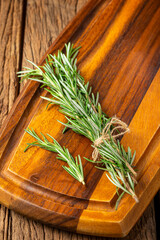 Fresh rosemary herb on the table.