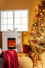Interior of living room with Christmas tree and fireplace