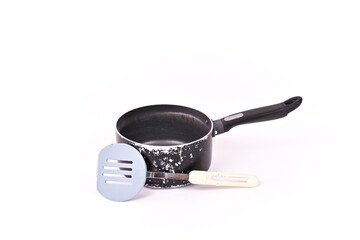 Old cooking pot and spatula.
