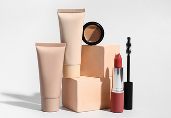 Set of makeup cosmetics on light background