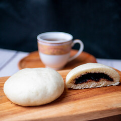 Bakpao, yeast-leavened filled bun in various Chinese cuisines, filling with chocolate
