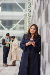 Young woman with her coworkers in the foreground.