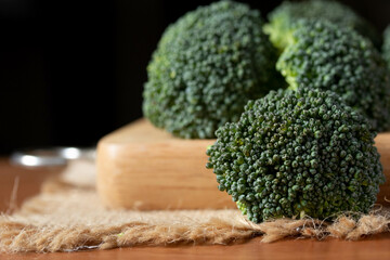 fresh broccoli on wooden background healthy or vegetarian food concept