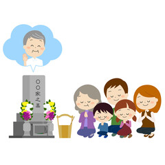 おじいちゃんのお墓参りをする家族（秋冬)