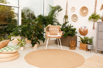 Room interior with stylish furniture and green plants