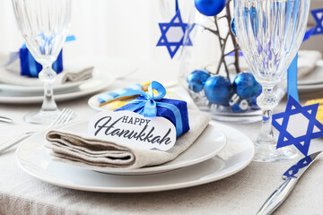 Beautiful table setting for Hanukkah celebration in dining room