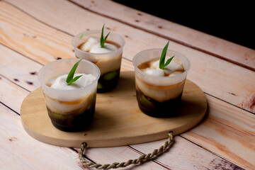 Lapis or Bubur Jongkong Indonesia's sweet porridge of rice flour, coconut milk and palm sugar syrup