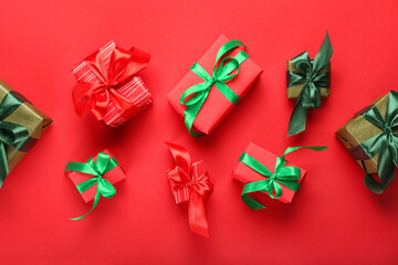 Many Christmas gifts on red background