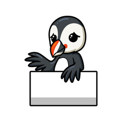 Cute little puffin bird cartoon with blank sign