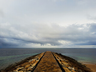 Path to the sea when the weather is cloudy