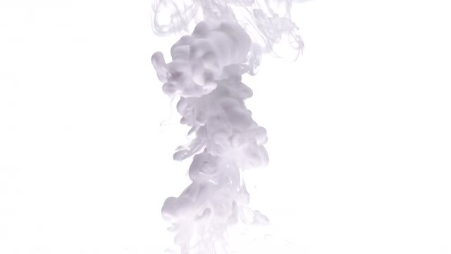 Figure of white color paint streams turns under transparent water as decorative abstract background slow motion extreme closeup