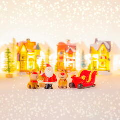 Christmas Concept of generic soft toy of Santa Clause with with reindeers and sleigh