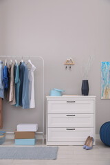 Modern hallway interior with stylish furniture and key holder