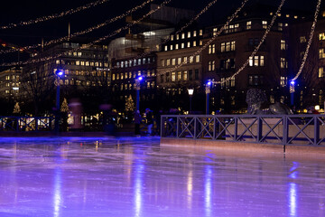 Winter in Stockholm. Ice skating in the square in Kungstradgarden. Sweden, Stockholm 