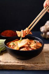 Korean kimchi cabbage in a bowl eating by chopsticks, Asian fermented food, Still Life