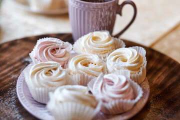 confectioner sprinkles icing sugar with dessert. Powder sugar falls on fresh perfect cupcakes or meringues