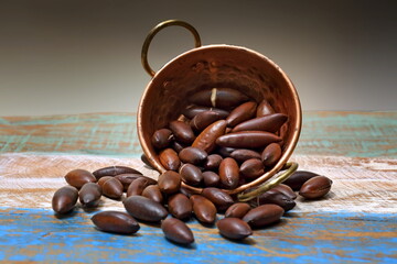 baru nuts on the copper platter on the table