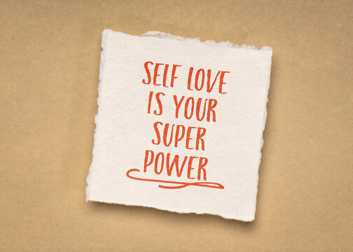self love is your super power - inspirational handwriting on a small square sheet of blank white Khadi paper against beige rag paper, personal development concept