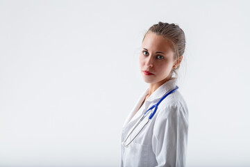 side portrait of young female doctor, serious and listening
