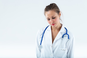 Fototapeta premium young doctor looks down to the left,
