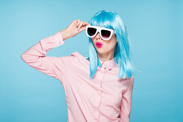 attractive woman in purple wig sunglasses model blue background