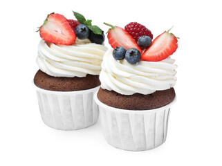 Sweet cupcakes with fresh berries on white background