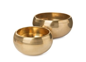 Two Tibetan singing bowls on white background
