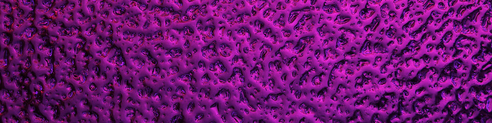 Bright purple winter banner. The surface of ice frozen on the window pane. An abstract pattern with a metallic sheen, similar to the ripples of mercury. Rich violet headline. Close-up