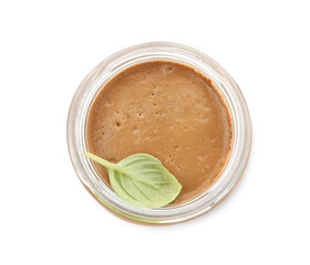 Delicious meat pate and basil leaf in glass jar isolated on white, top view