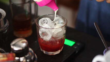 a glass of strawberry jam milkshake