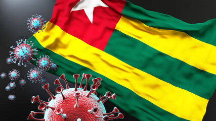 Togo and the covid pandemic - corona virus attacking national flag of Togo to symbolize the fight, struggle and the virus presence in this country, 3d illustration