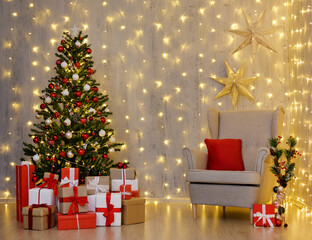 Christmas tree, heap of gift boxes and vintage armchair over grey wall with led lights