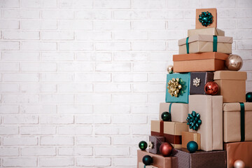 Christmas background - close up of gift boxes laid out in the shape of a Christmas tree and copy...