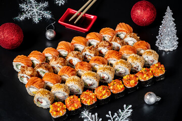 tasty sushi on the Christmas table © Maksim Shebeko