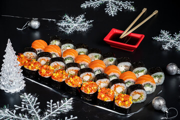 tasty sushi on the Christmas table © Maksim Shebeko