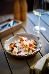 Cesar salad with croutons and fresh fruits