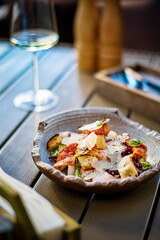 Cesar salad with croutons and fresh fruits