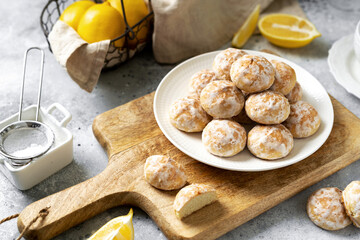 Lemon gingerbread in a white plate on a light gray culinary background. Delicious homemade cookies closeup	
