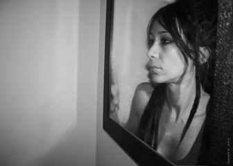 The girl is inside the mirror. Black and white style