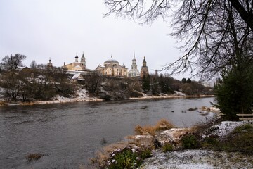 View from river on architectural ensemble of ancient monastery in  Russian city Torzhok, Tver...