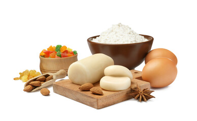 Marzipan and other ingredients for homemade Stollen on white background. Baking traditional German Christmas bread