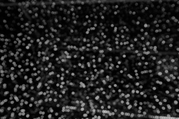 Gray bokeh background. blur abstract glowing  bright night effect defocused  circle. backdrop for decoration celebrate party holidays. merry christmas and happy new year 2022 concept.