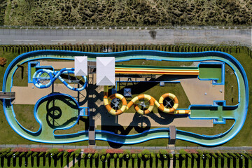 Top down view of water slides toboggan in a closed or out of season leisure park 