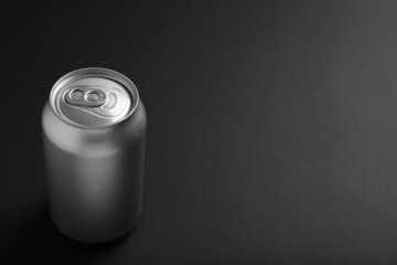 Can of energy drink on black background. Space for text