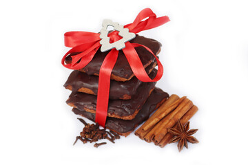 Stack of traditional italian Mostaccioli cookies tied with red ribbon isolated on white background