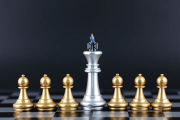 Miniature world chess game and businessman