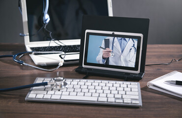 Tablet, stethoscope, headset. Online doctor. Telemedicine concept