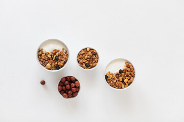 Homemade breakfast granola with nuts and raisins. Healthy food.
Copy space. Top view.